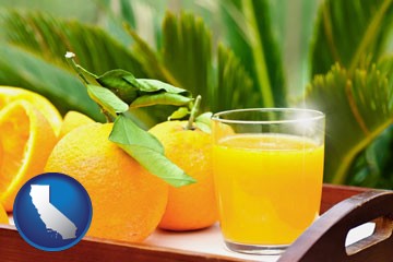 orange juice and fresh oranges - with California icon