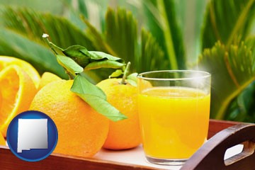 orange juice and fresh oranges - with New Mexico icon