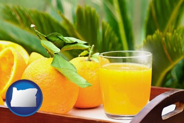 orange juice and fresh oranges - with Oregon icon