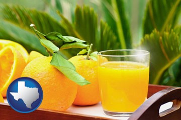 orange juice and fresh oranges - with Texas icon